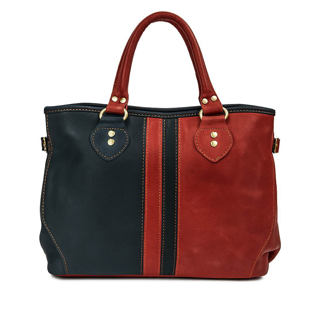 Two-tone red and black handbag on a white background